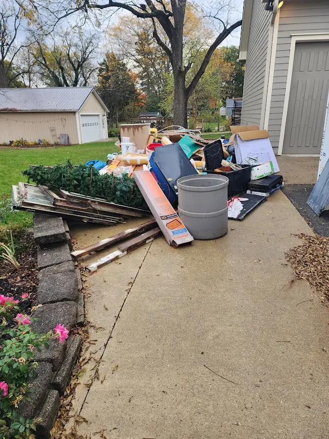 Dumpster being loaded with debris for Residential Dumpster Rental in Tallapoosa
